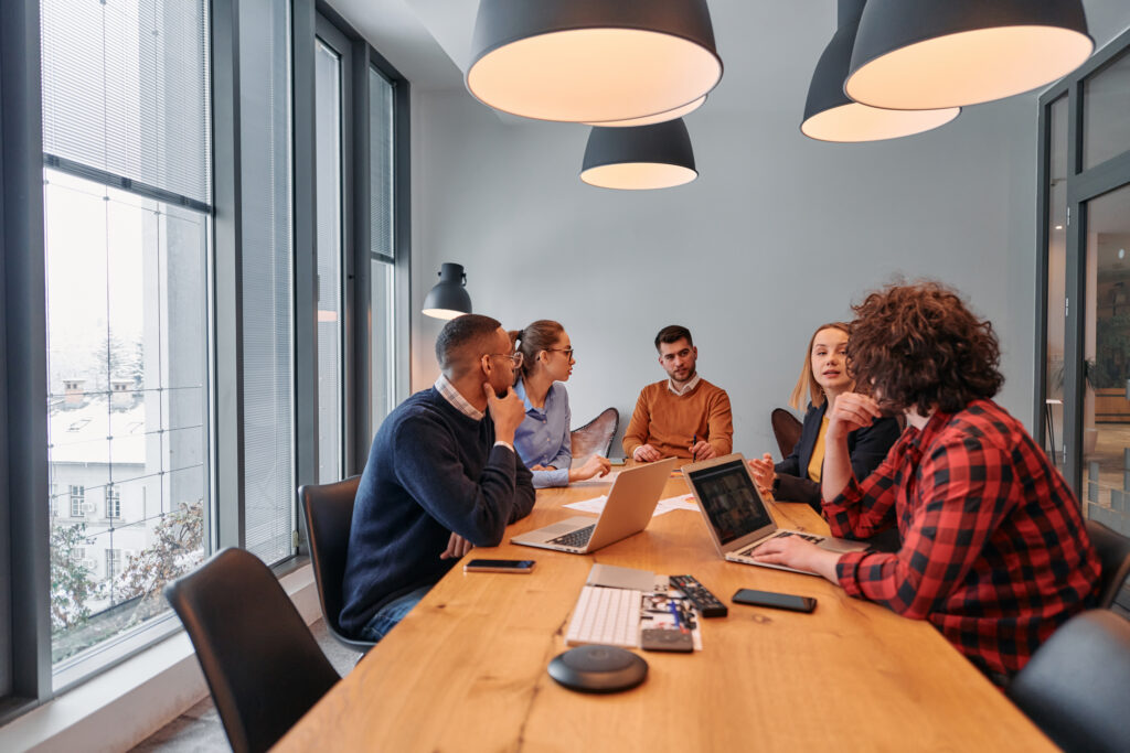 A team of professionals brainstorming in a cozy office setting.
